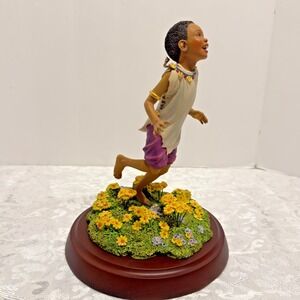 The JOYS OF SPRING Thomas Blackshear Ebony Visions Figurine African American Boy